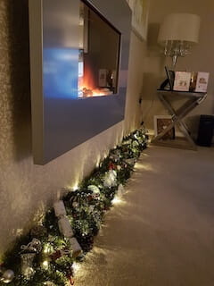 Garlands are not just for fireplaces! There was no room at the inn for a tree here, so we got inspired!